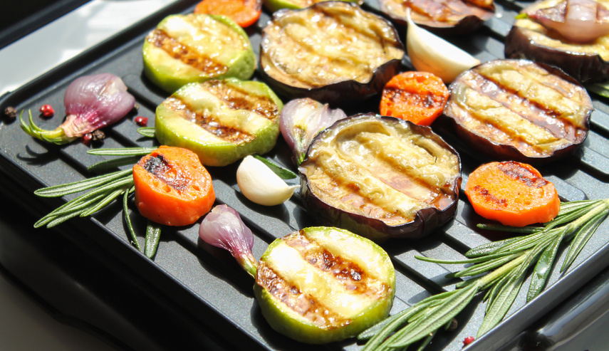Healthy summer glazed grilled BBQ veggies with herbs close-up